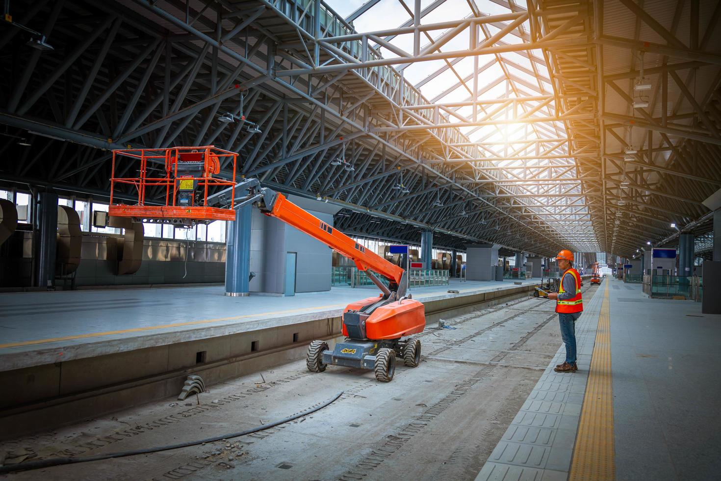 Engineer railway under  checking construction process train testing and checking railway work on railroad station with radio communication .Engineer wearing safety uniform and safety helmet in work. photo