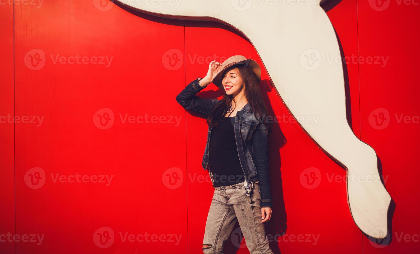 bright stylish pretty girl posing in hat photo