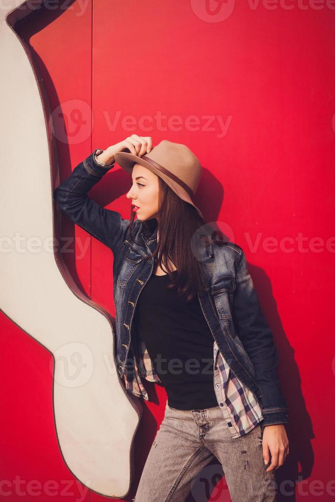 trendy beautiful brunette in posing photo