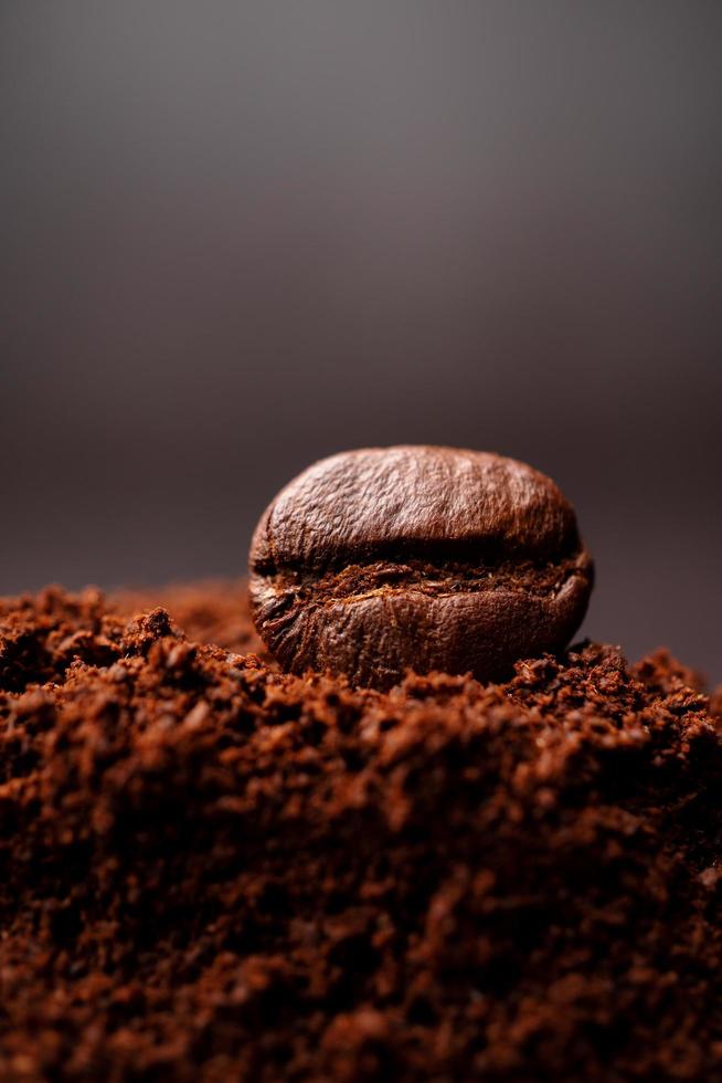 Closeup of coffee beans at the mixed heap of roasted coffee with copy space for text. Concept of Coffee freshness photo