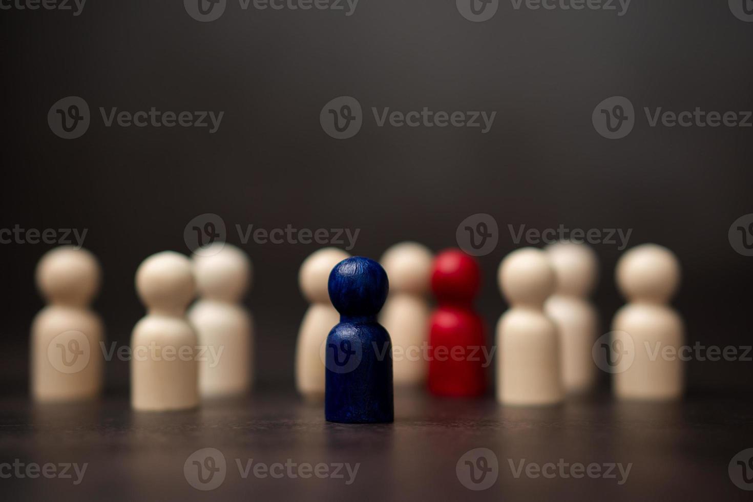 The leadership of the wooden figure standing on the box show influence and empowerment. Concept of business leadership for leader team, successful competition winner and Leader with strategy photo