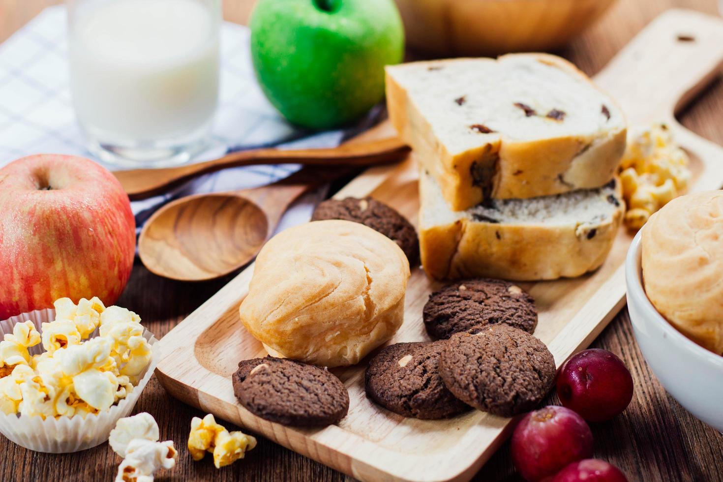 breakfast with cookie, bread , fresh fruits for healthy eating and milk photo