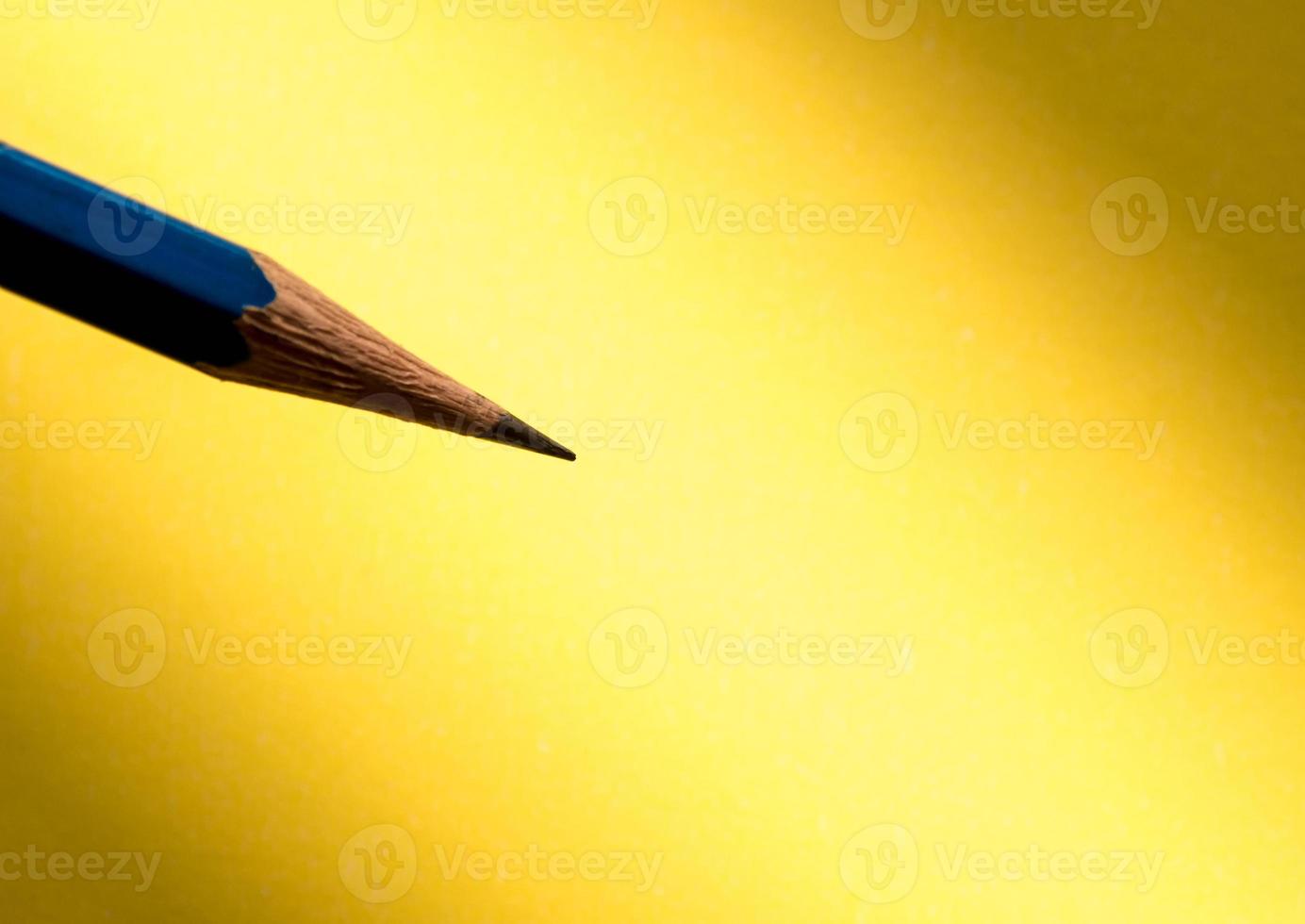 Pencil holding to write on the paper in shadow photo