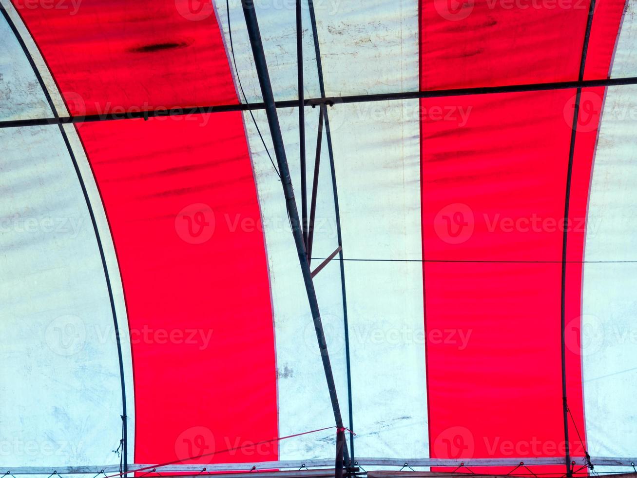 The old red and white canvas roof of the temporary building photo