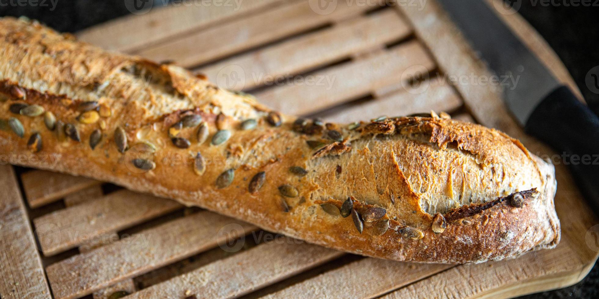 baguette pumpkin seeds french fresh bread fresh portion healthy meal food photo