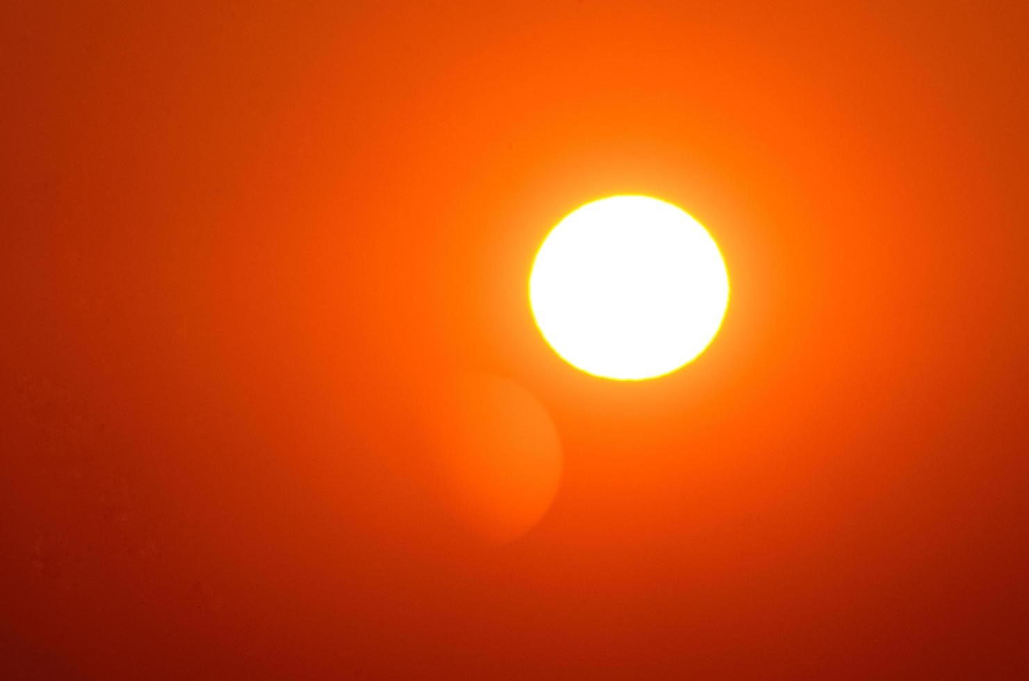 bright white sun with orange photo