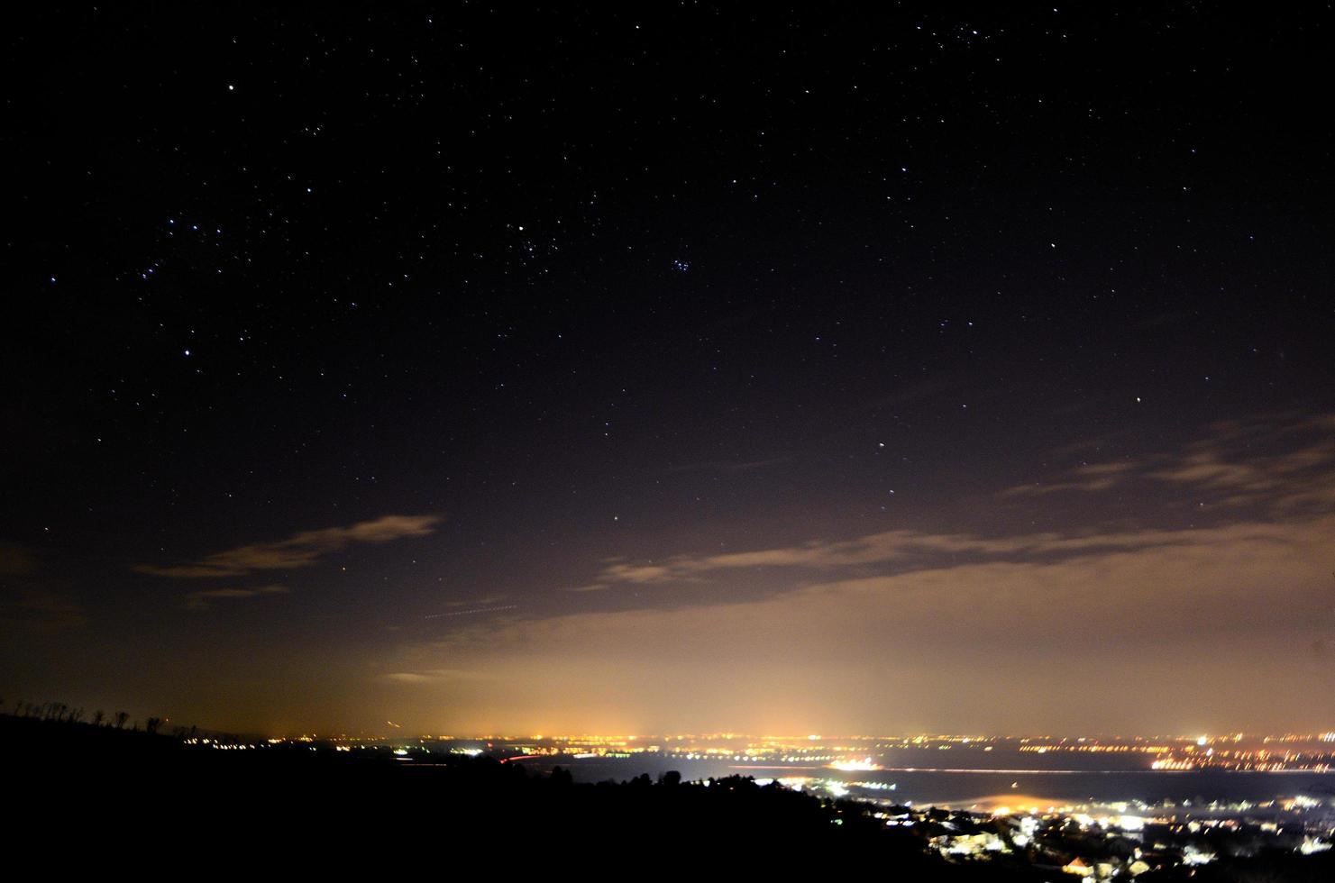 city with lights and starry photo