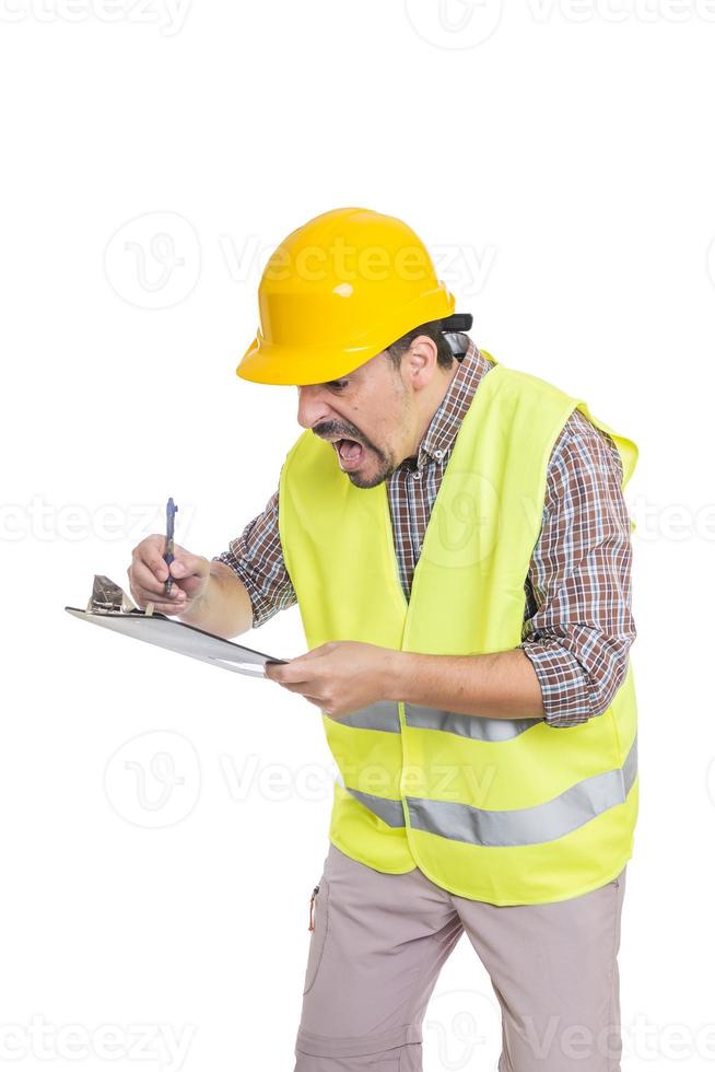 Panicking male engineer taking notes on clipboard photo