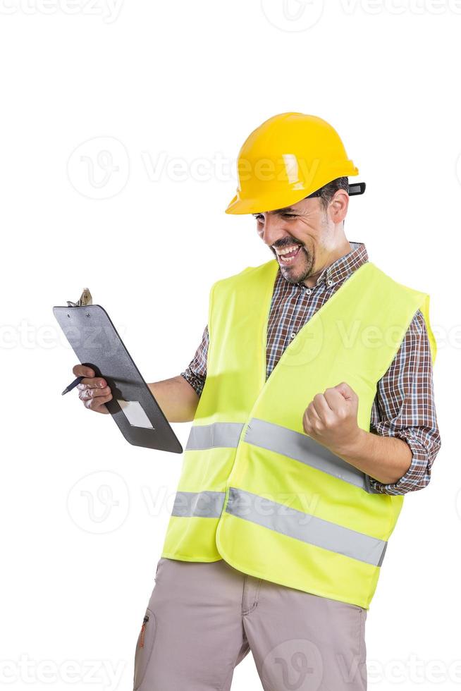 Excited builder in uniform celebrating victory photo