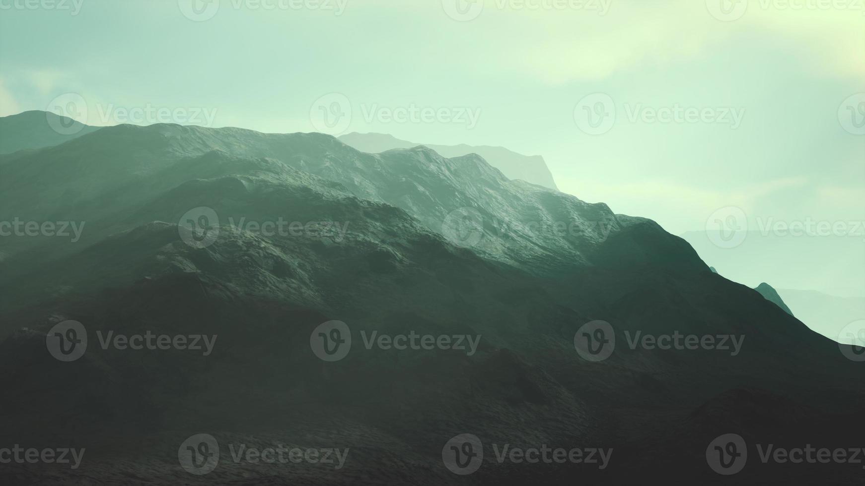 night desert landscape with rocky mountains and sunset photo