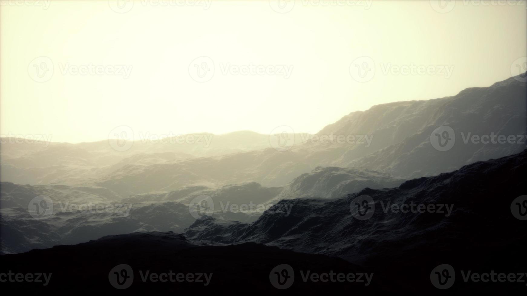 Rocks and mountains in deep fog photo