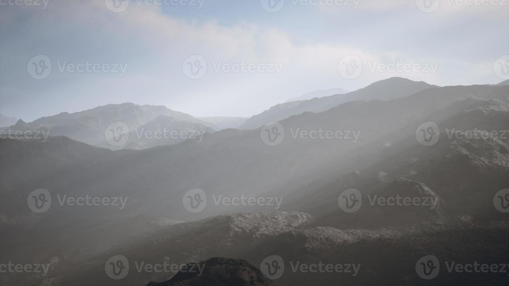 Stone field in dense fog in highlands photo