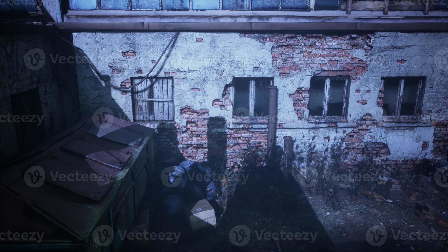 frightening abandoned factory at night photo