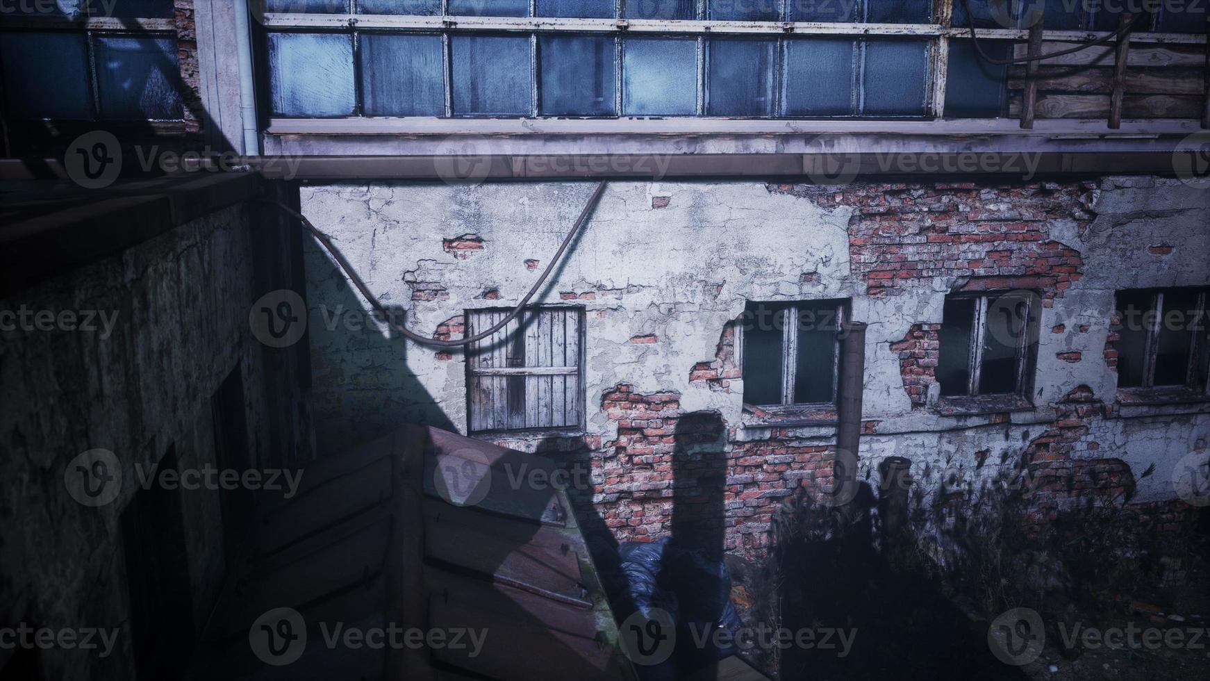 frightening abandoned factory at night photo