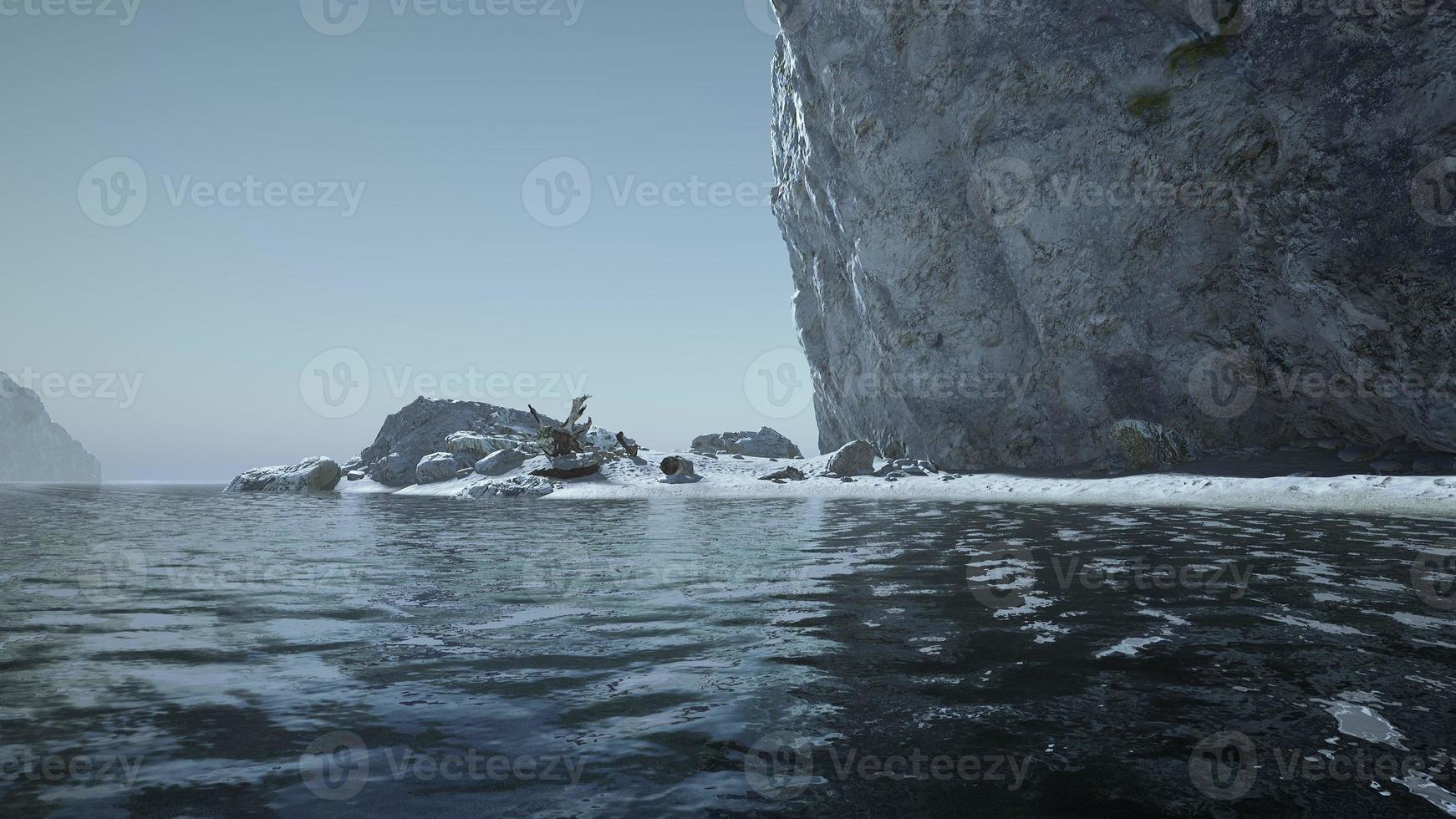 Private Beach Below Sandstone Cliffs in ocean photo