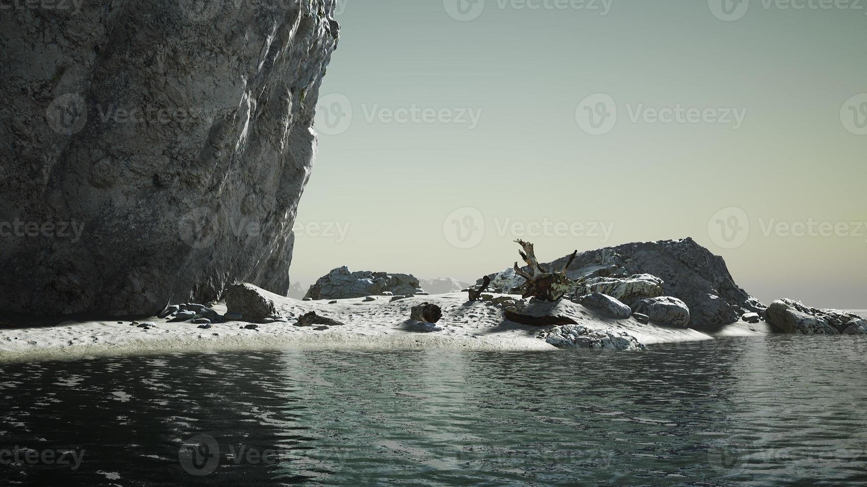 stone cliffs and broun sand at the ocean coastline photo