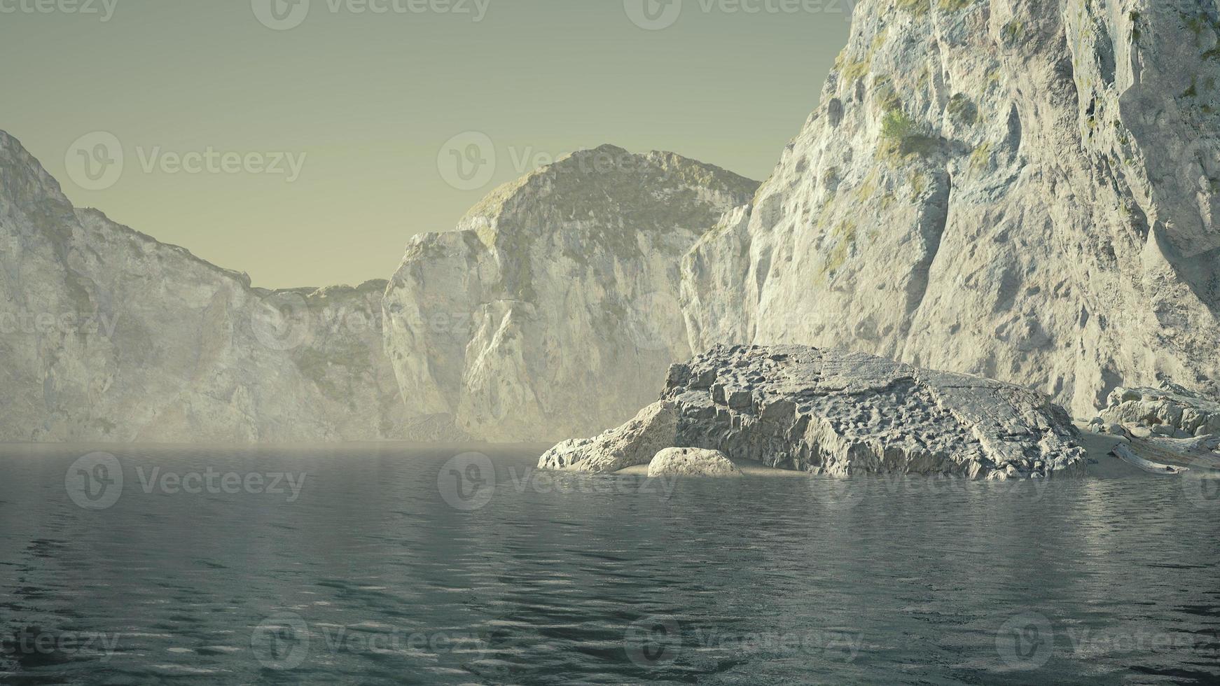 stone cliffs and broun sand at the ocean coastline photo