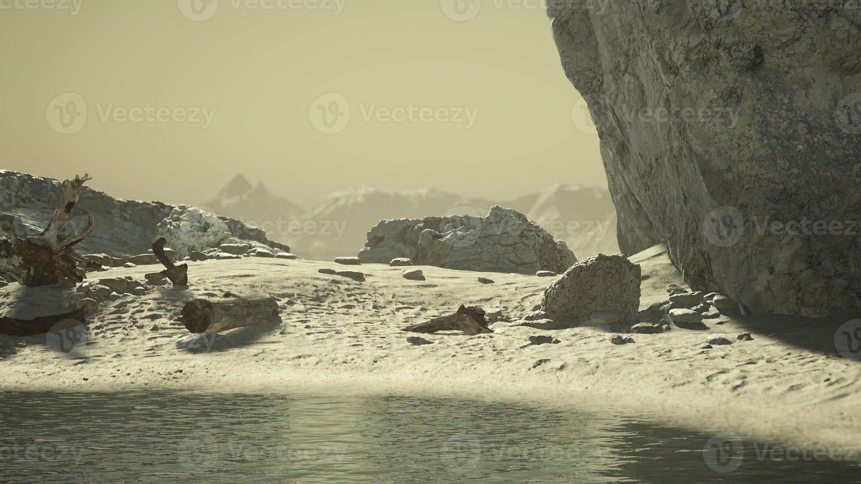 rocky ocean coast with mountains and a beautiful sand beach photo