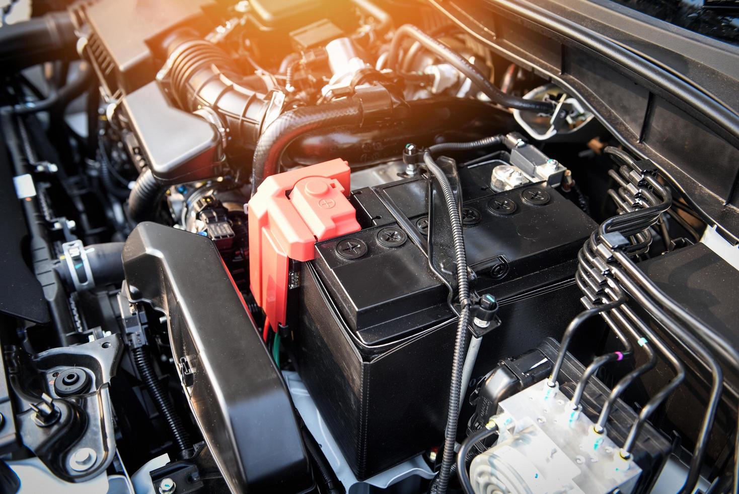 battery car engine detail motor - close up of machine new batteries car engine checking car battery cleaning for deliver customers in the car service photo