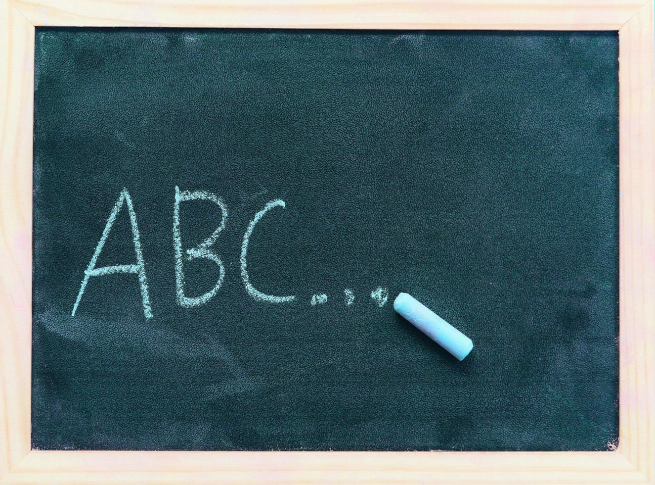 Blackboard dark or chalkboard with horizontal and banner blackboard texture chalk draw and write A B C for education in school chalkboard background photo