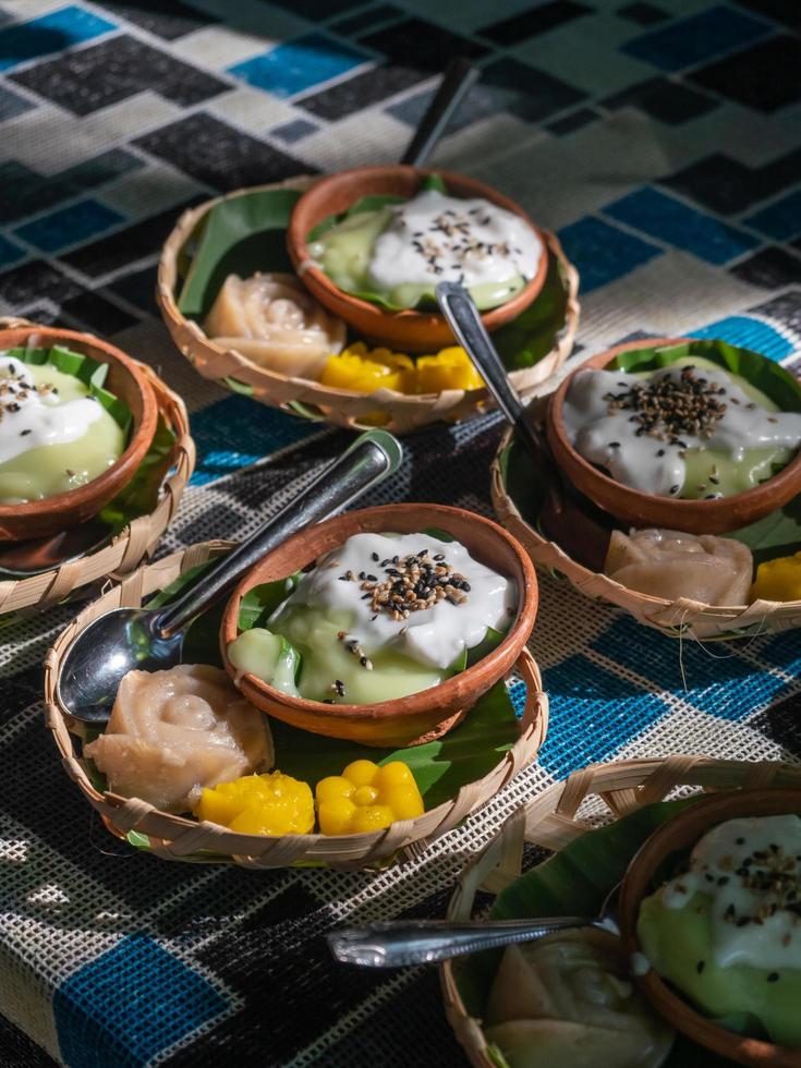 ThaiVarious Thai desserts in a small bamboo basket. Food on the table. photo