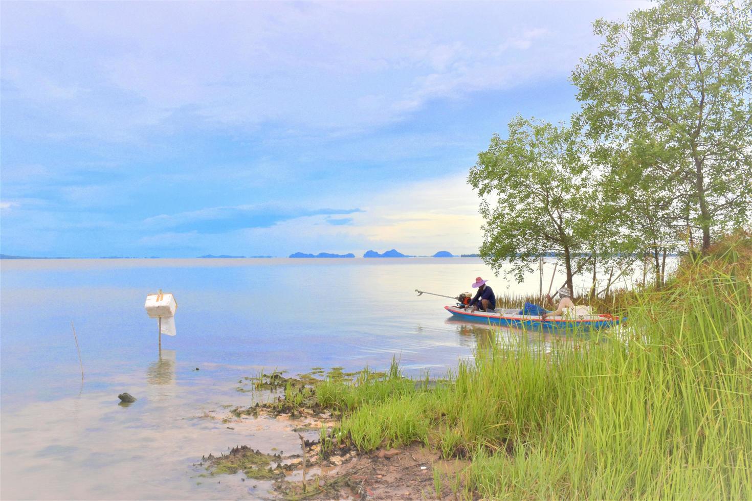fisherman and seascape sunset beauty nature in south Thailand photo