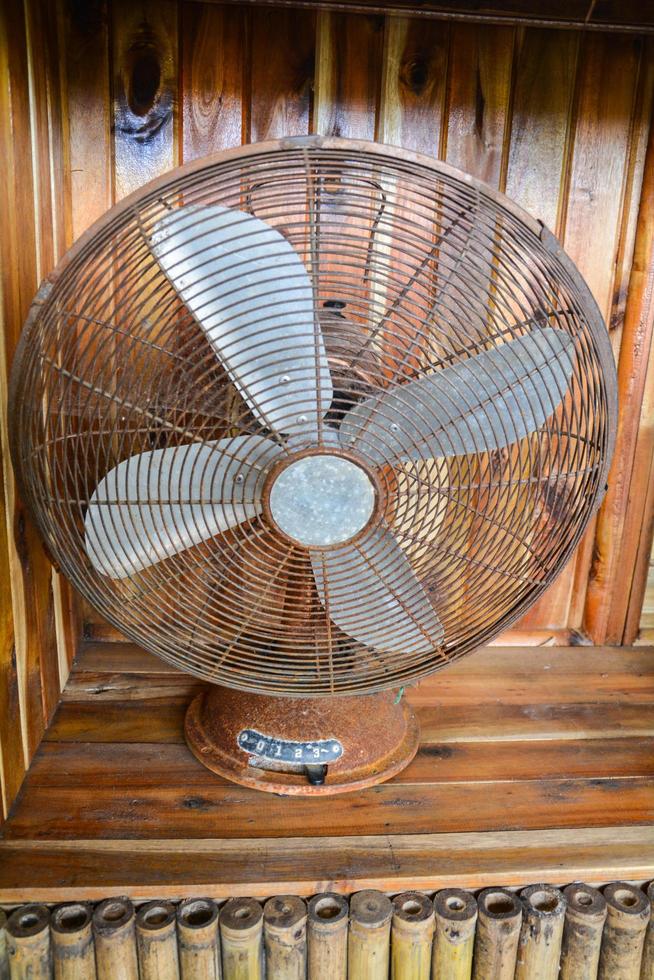 classic vintagn old fan on wooden floor photo