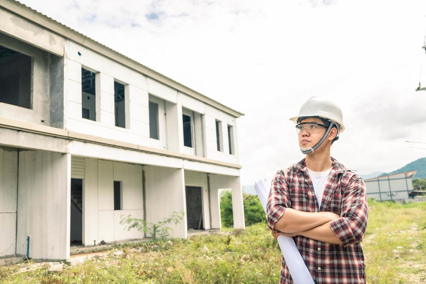 Young asian checking house with foreman engineering home inspection building house Walk home inspection with looking and pointing construction for check building home on job site to construction 2021 photo