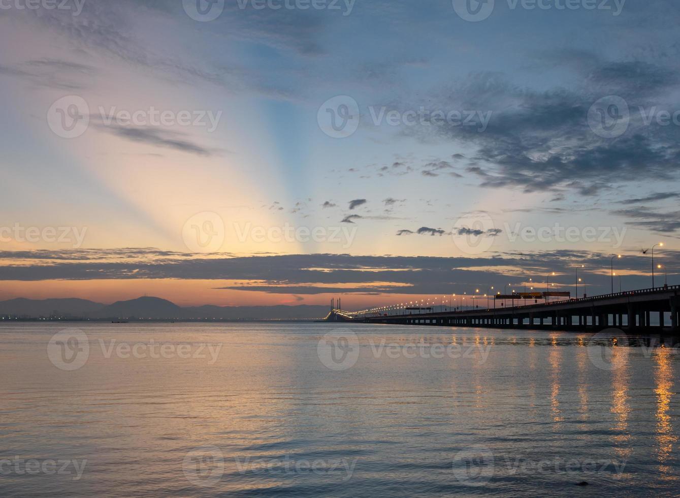 Sun ray over Penang Bridge morning photo