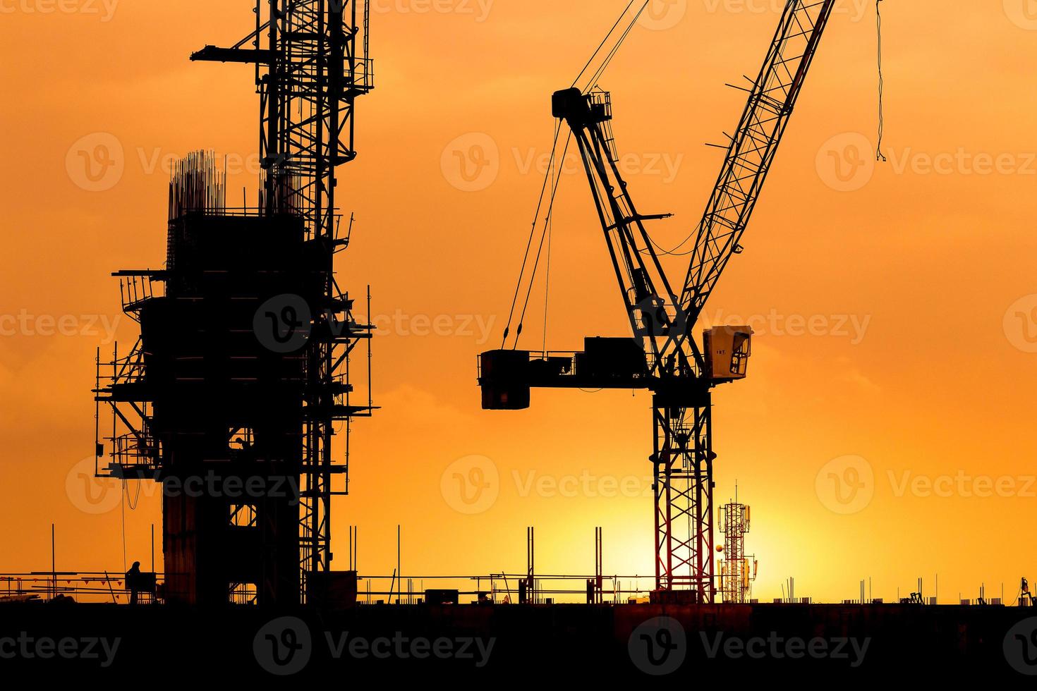 construction cranes and building silhouettes photo