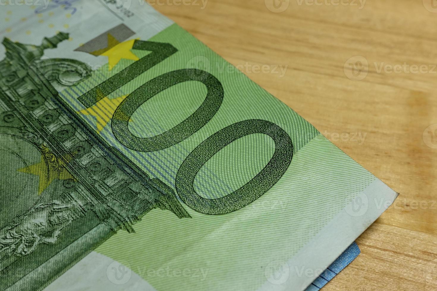 Euro banknotes in salary brown envelope. photo