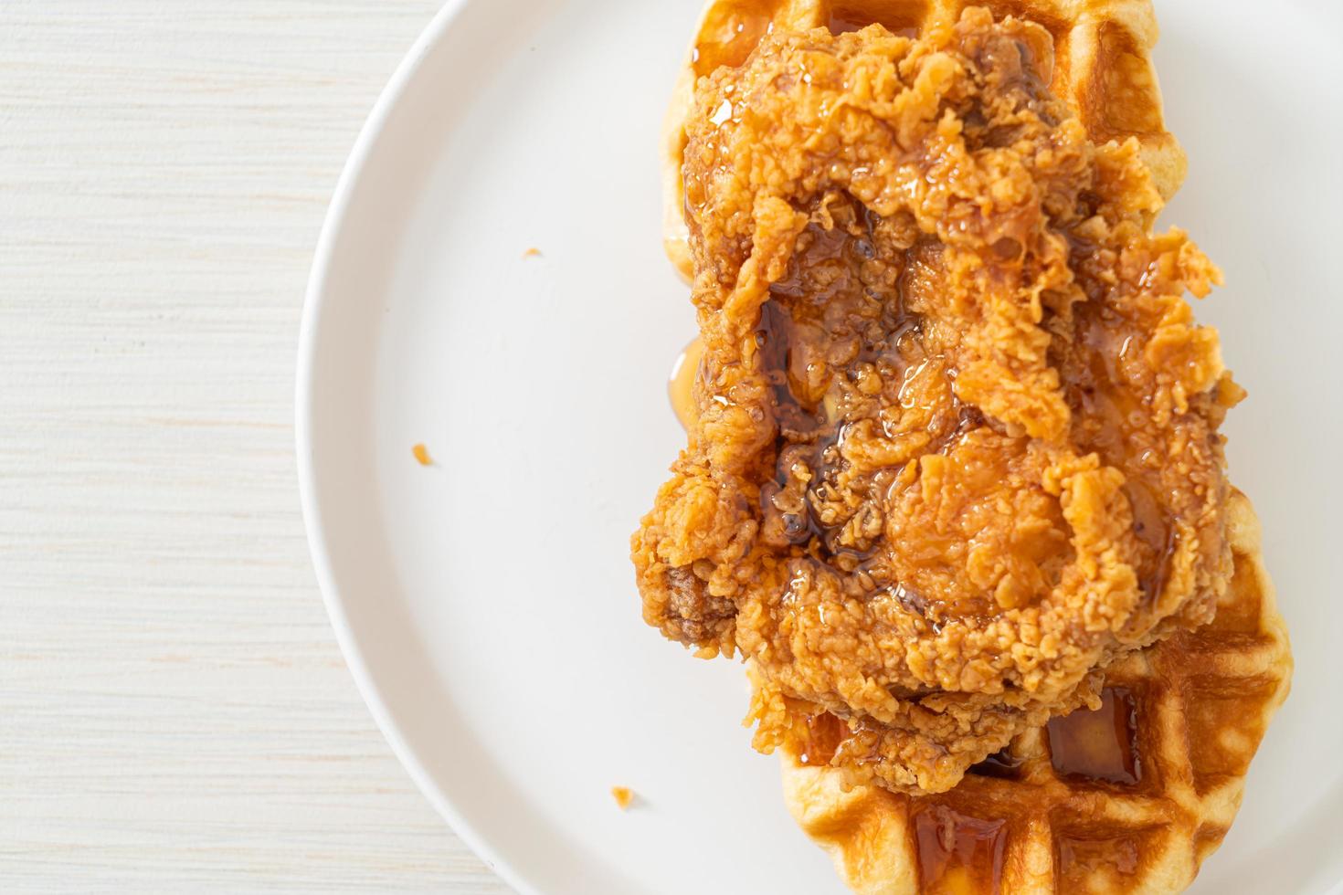 fried chicken waffle with honey or maple syrup photo