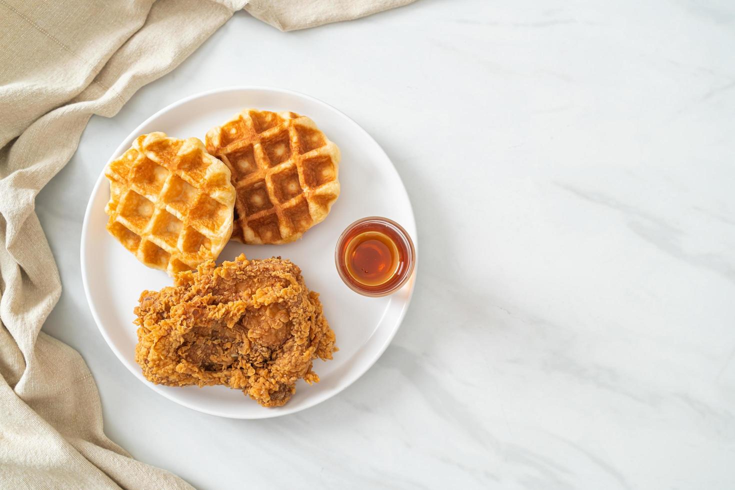 fried chicken waffle with honey or maple syrup photo