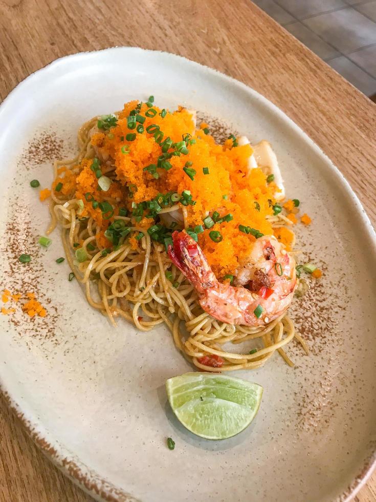 stir-fried angle hair spaghetti with seafood and shrimp egg photo