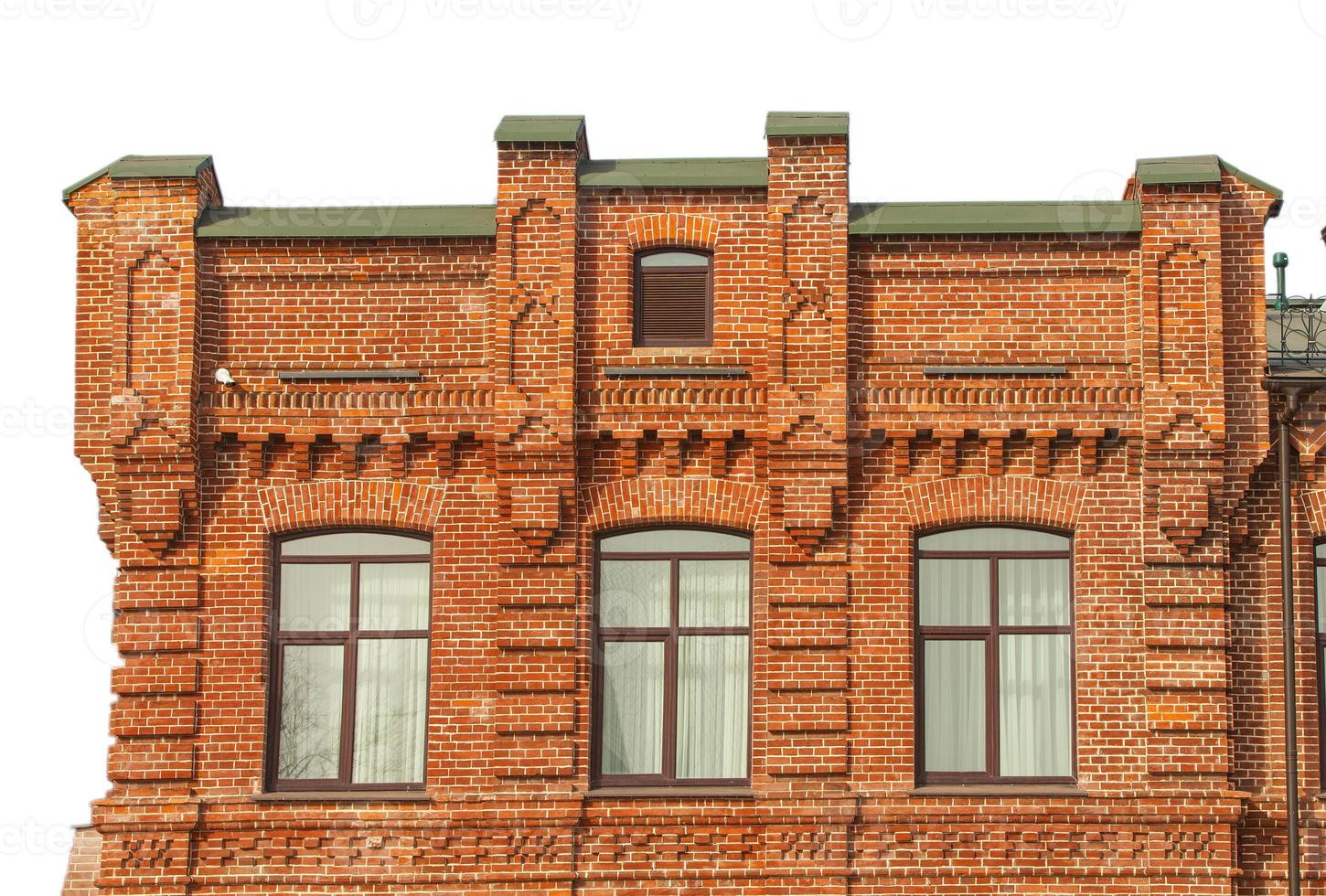 facade of the three-storey red brick building photo