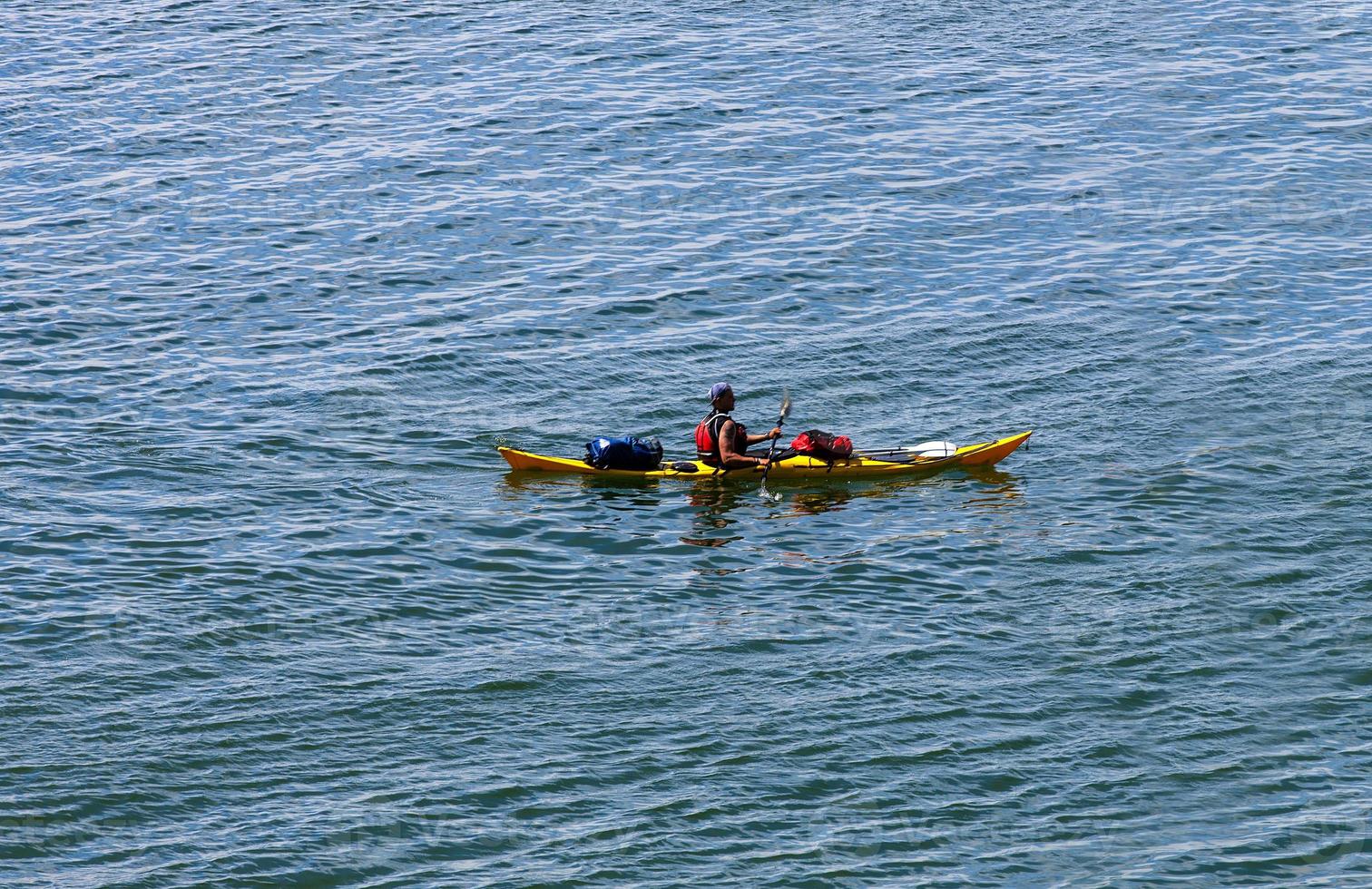 A man in a sea kayak photo