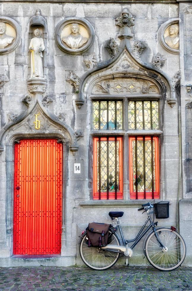 BRUGES, BELGIUM, 2015. Bicycle outside a Property in Market Square Bruges photo