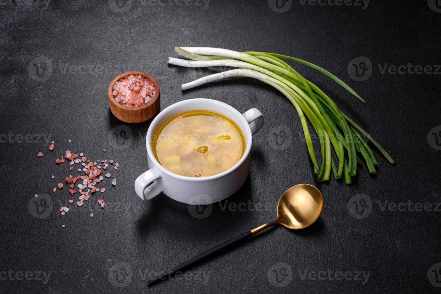 Fresh pea soup in bowl on black background. Cooking at home photo