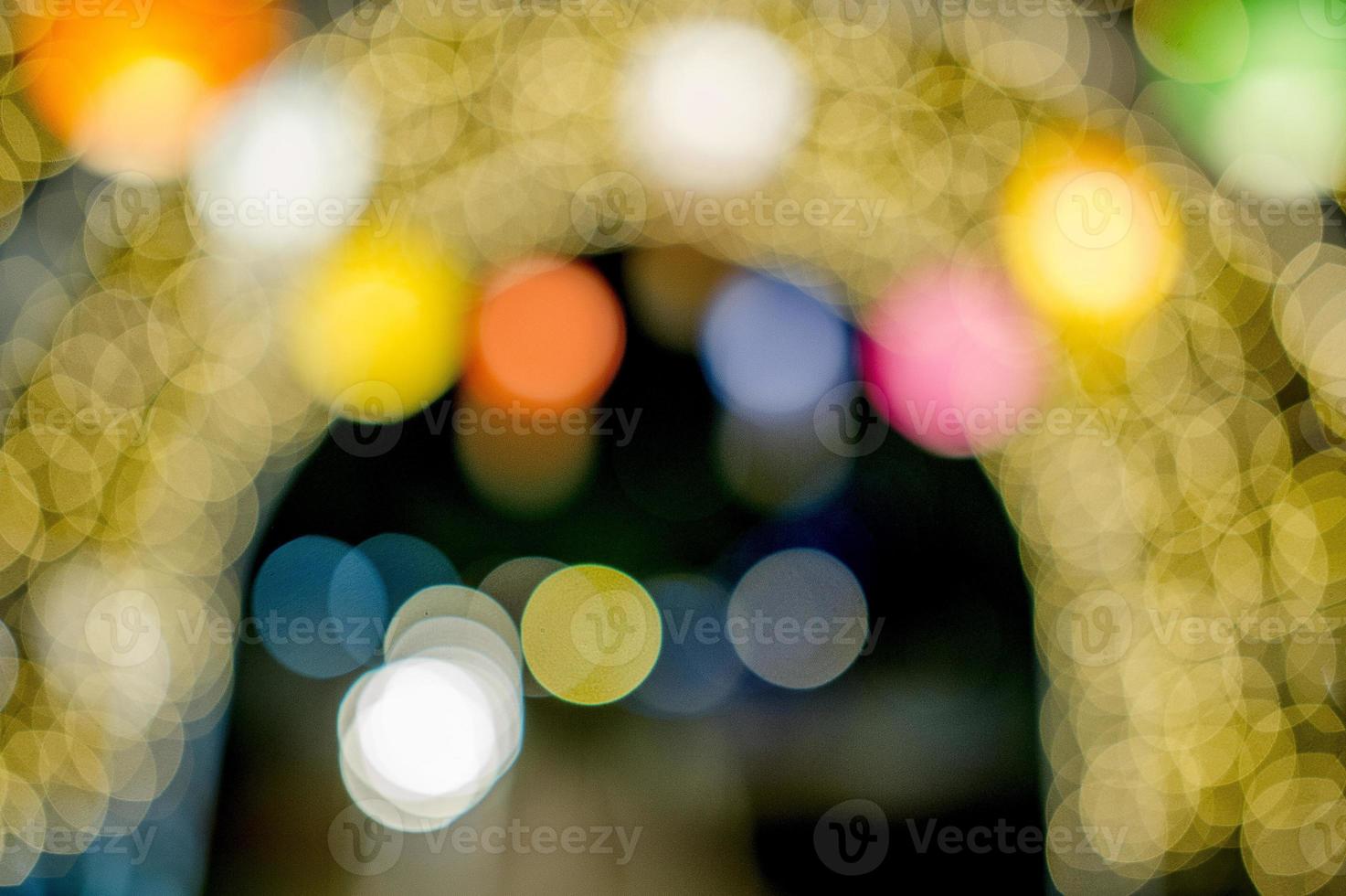 luces de colores el día de año nuevo, luces de círculo de bokeh, imagen de fondo con espacio de copia. foto