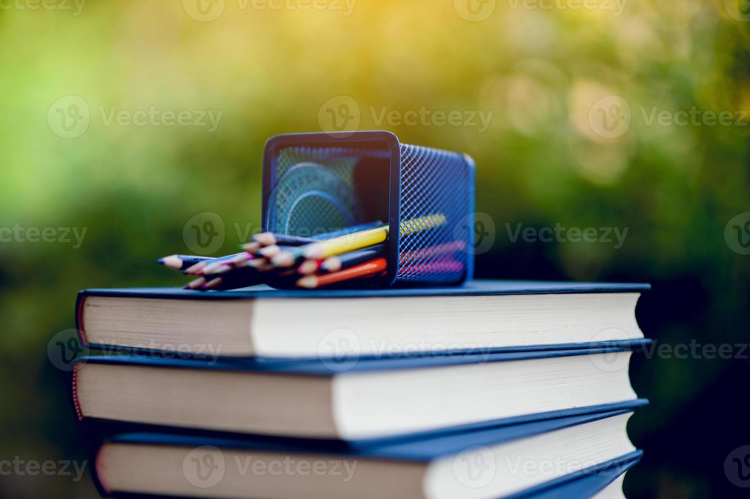Many books are placed on the table, school supplies. Education concept photo