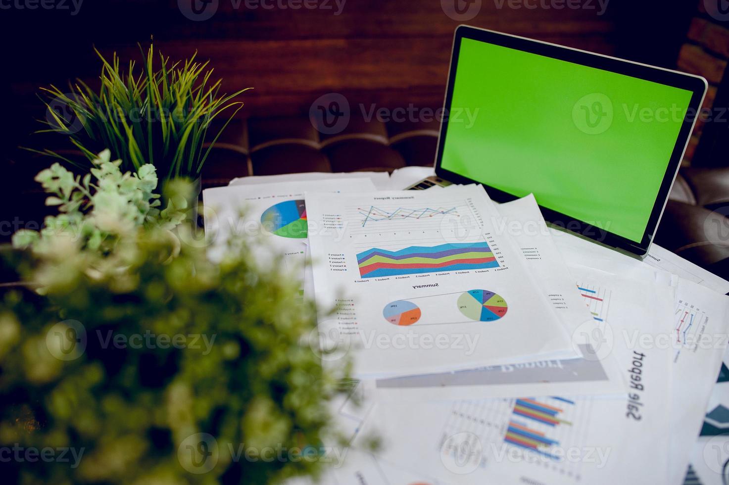 The desk and graph are placed on the business desk. Business concept With copy space photo