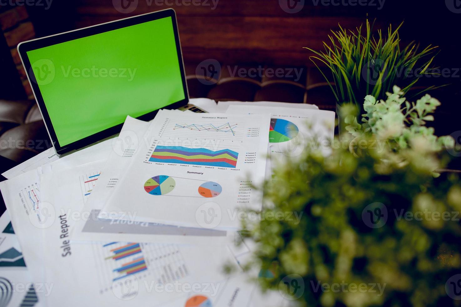 The desk and graph are placed on the business desk. Business concept With copy space photo
