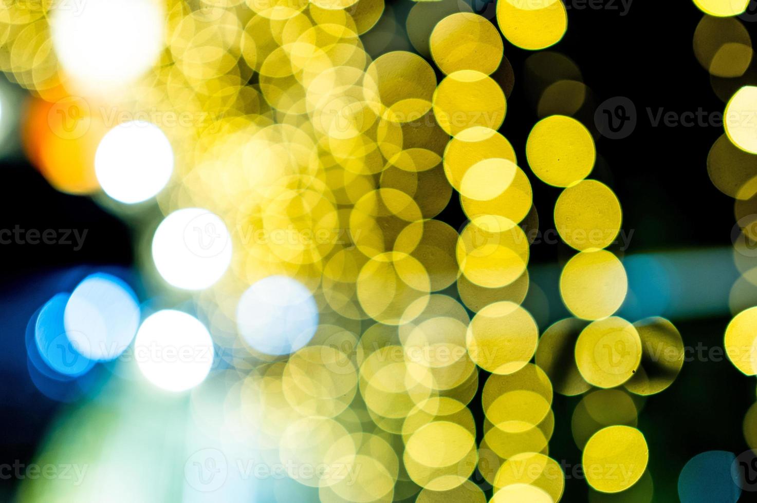 luces de colores el día de año nuevo, luces de círculo de bokeh, imagen de fondo con espacio de copia. foto