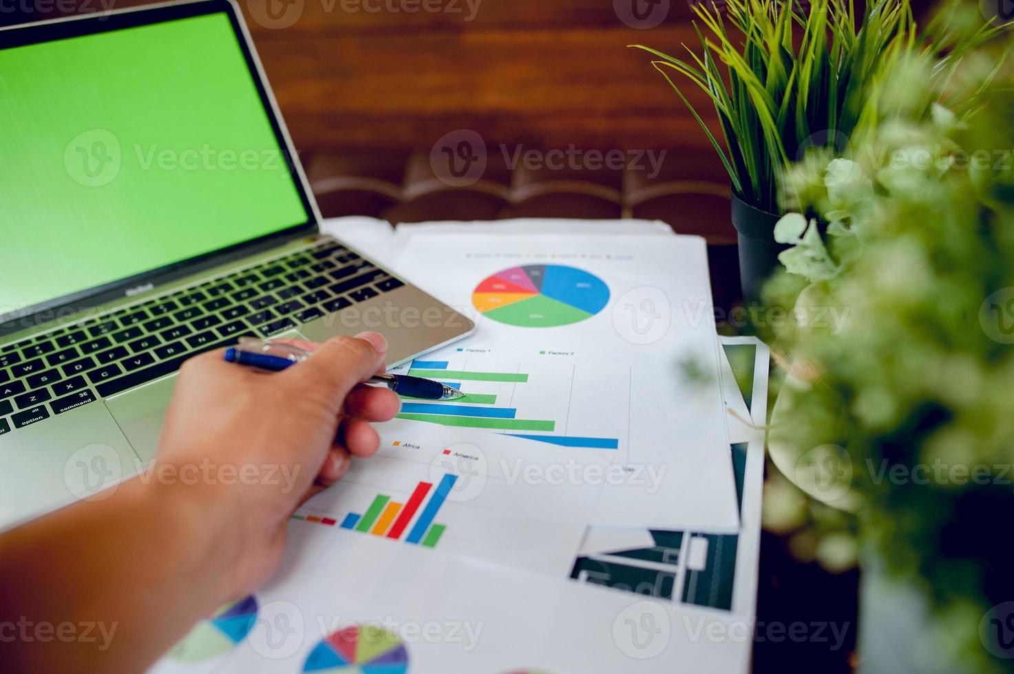 The desk and graph are placed on the business desk. Business concept With copy space photo