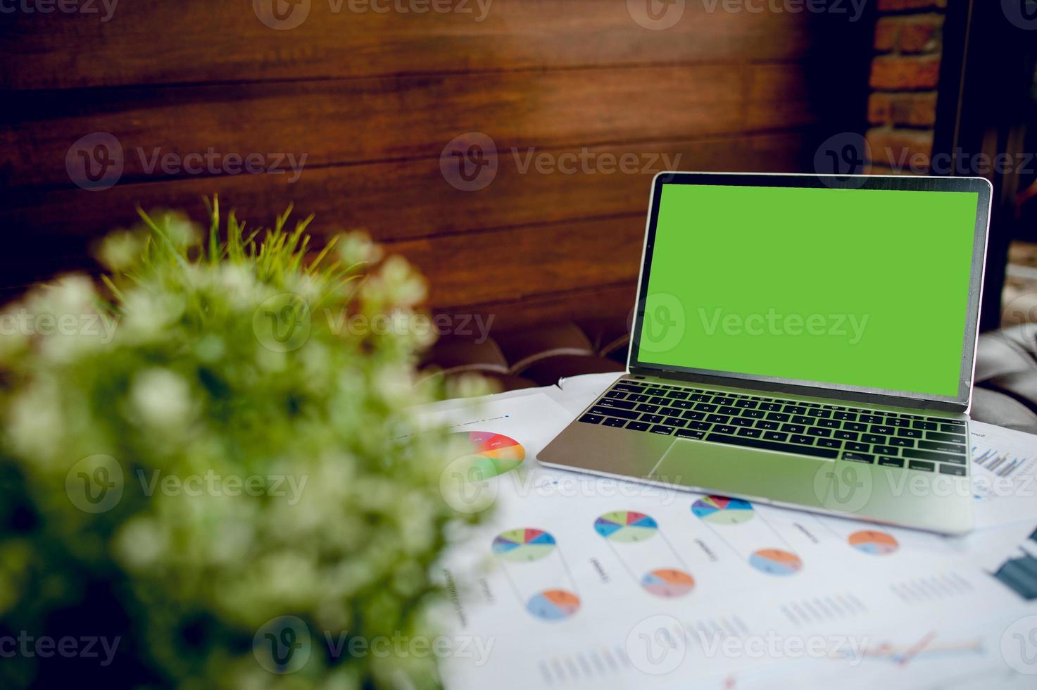 The desk and graph are placed on the business desk. Business concept With copy space photo