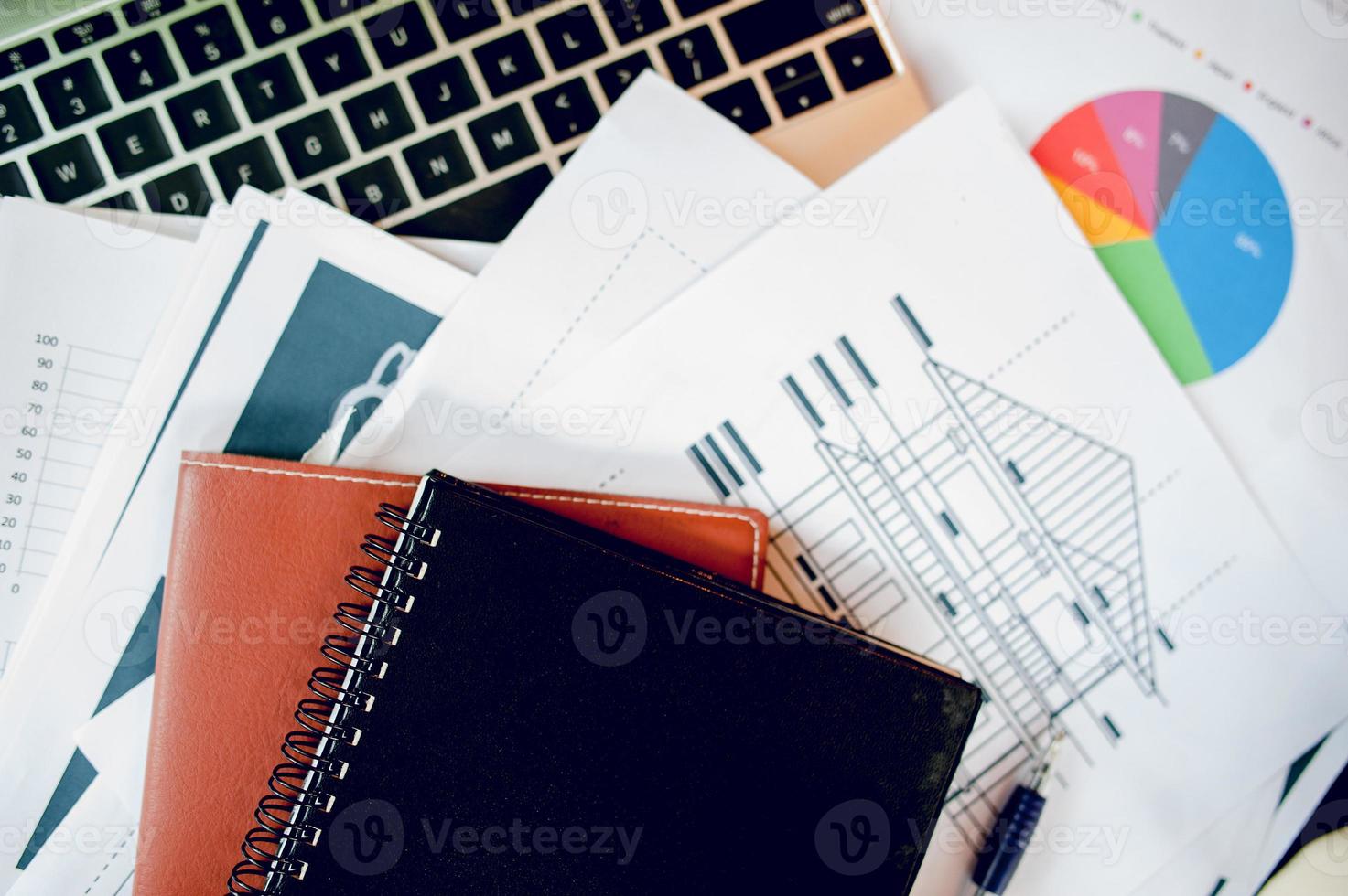 The desk and graph are placed on the business desk. Business concept With copy space photo