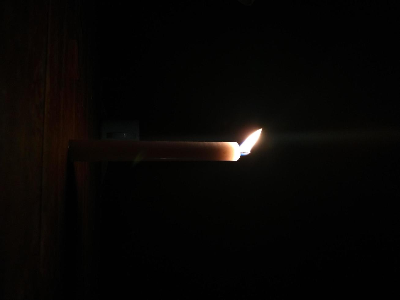 Candlelight in the dark night photo