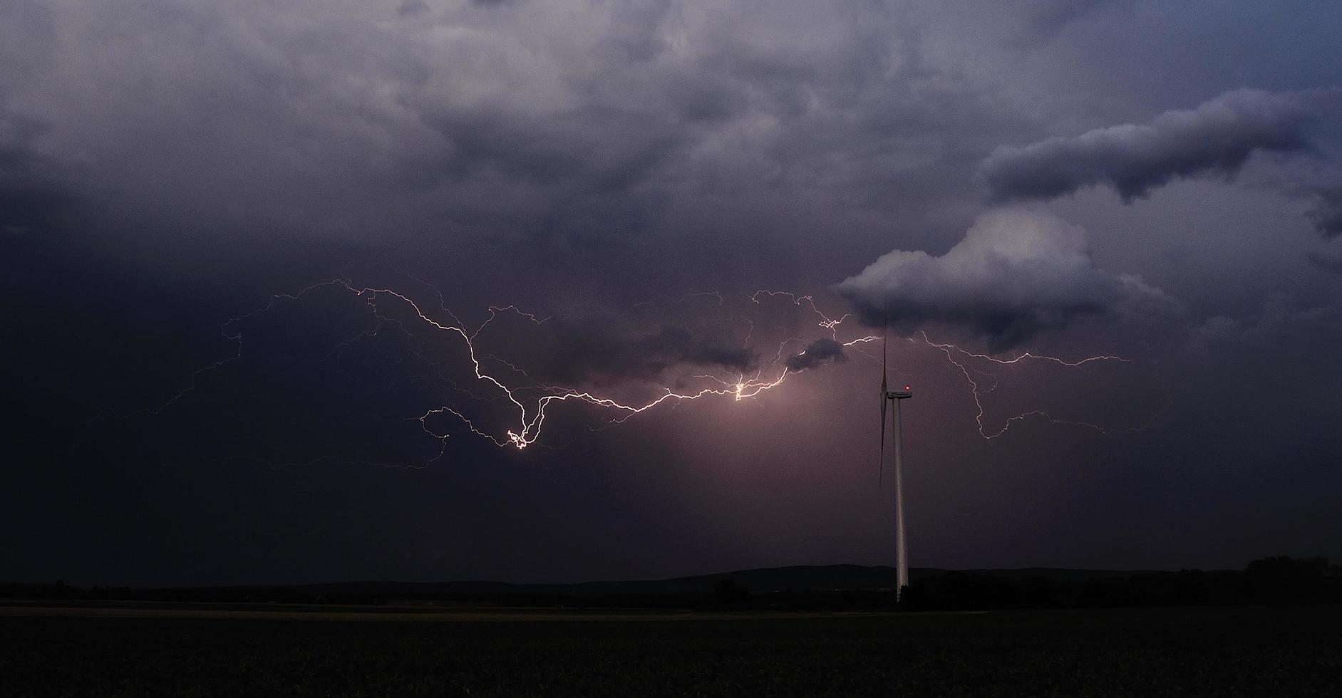 beautiful lightning and wind turbine panorama photo
