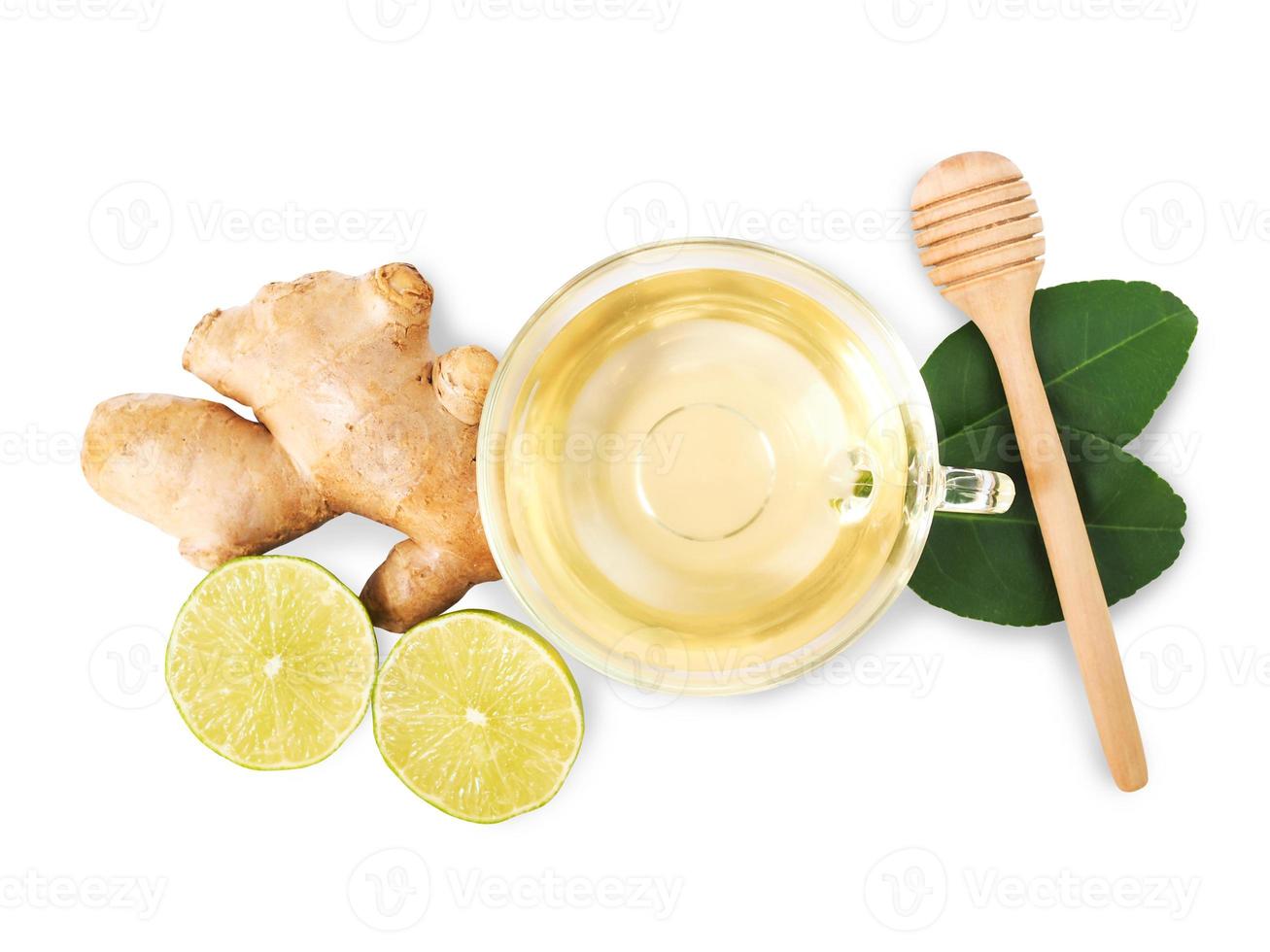 Drink ingredients with tea and herbs, ginger, lime lemon citrus and honey with green leaves. photo