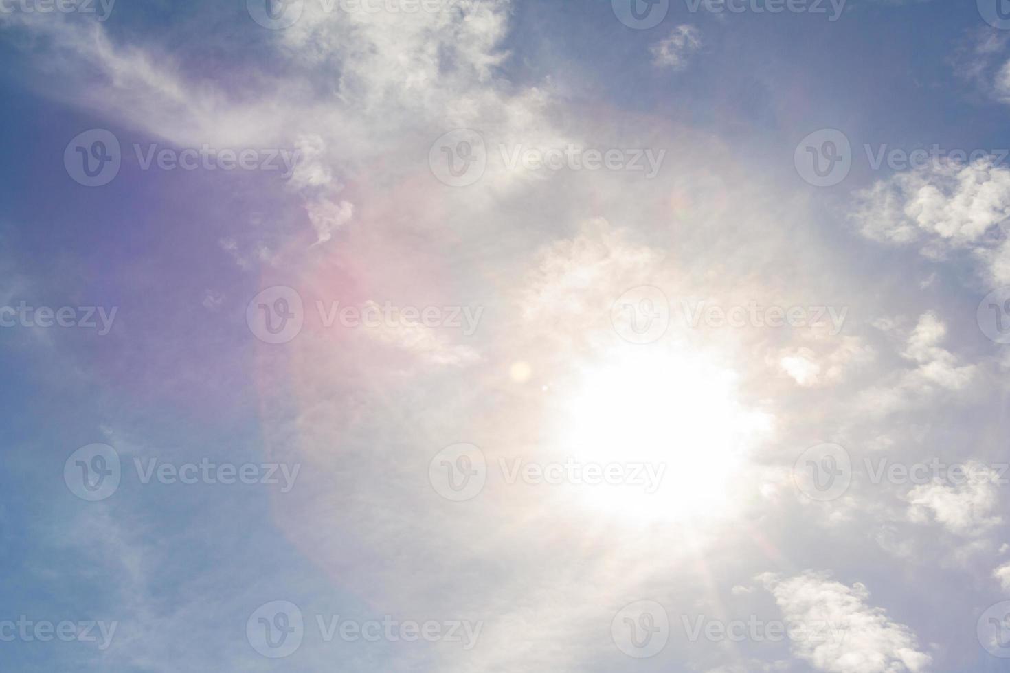 The sunlight and flare with the blue sky background. photo